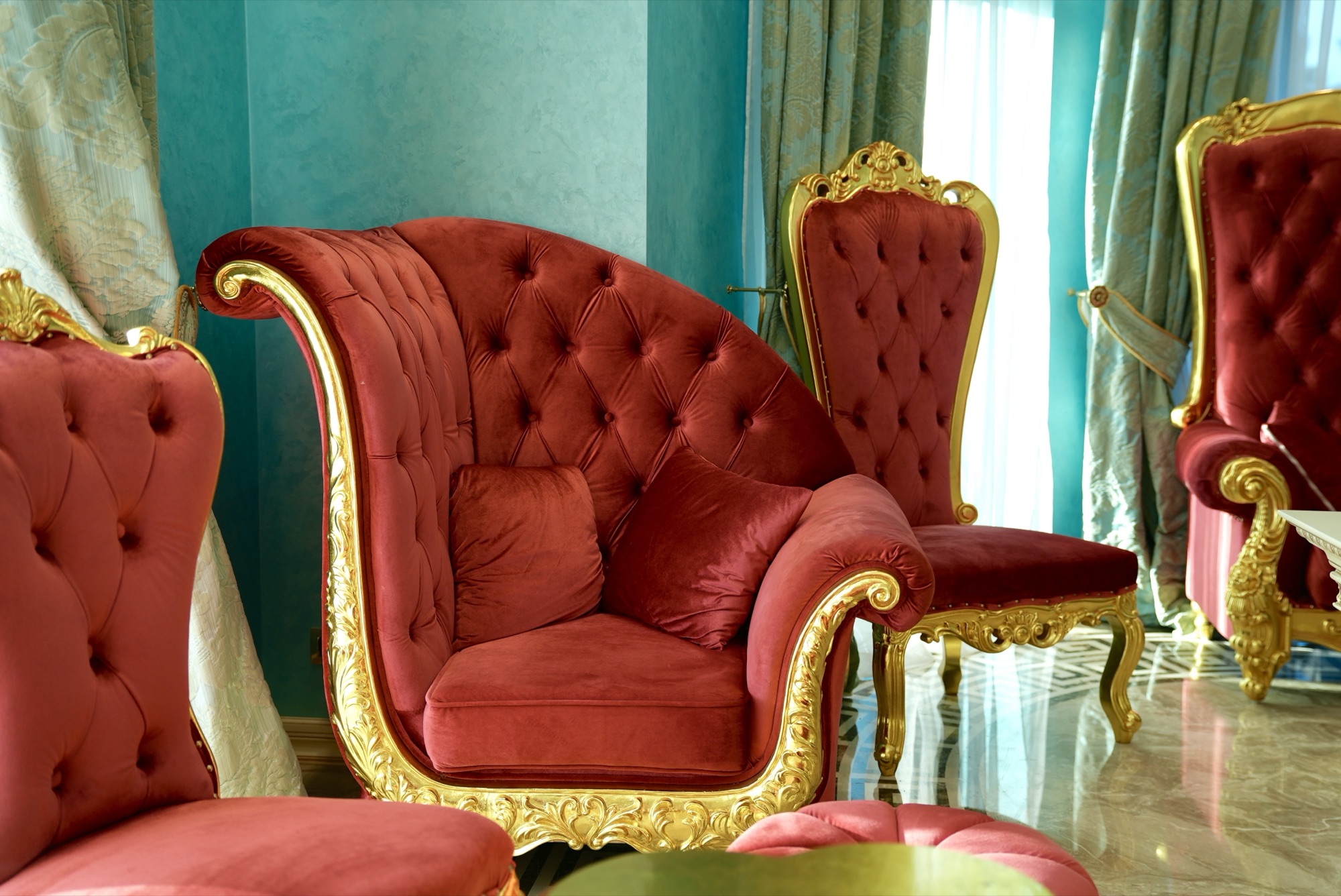 Layered curtains and tufted upholstery